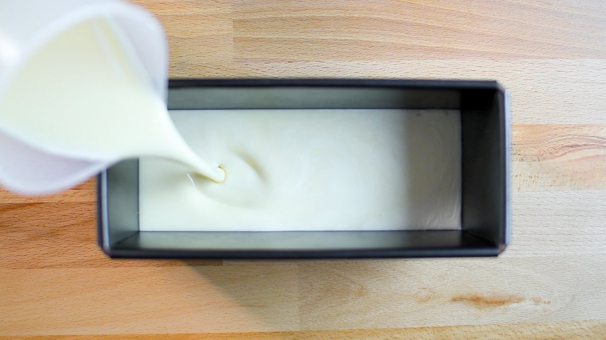 Strain the custard mixture once, then pour it into the mold with the caramel.