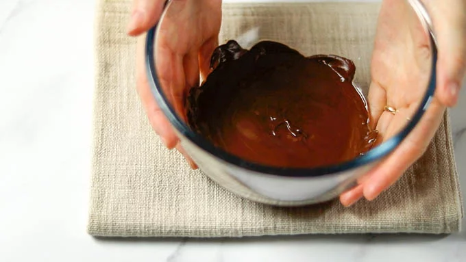 Melt the chocolate in a microwave or over a pan of simmering water