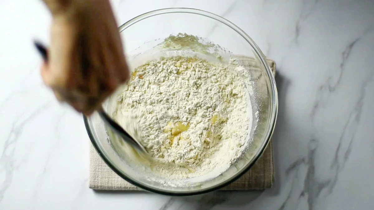 Sift in the flour and baking powder, and mix gently with a rubber spatula.