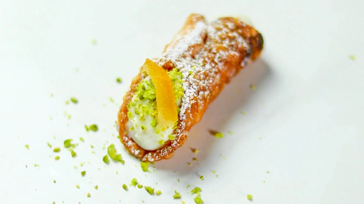 Garnish with chopped pistachios or orange peel and sprinkle with powdered sugar, if desired