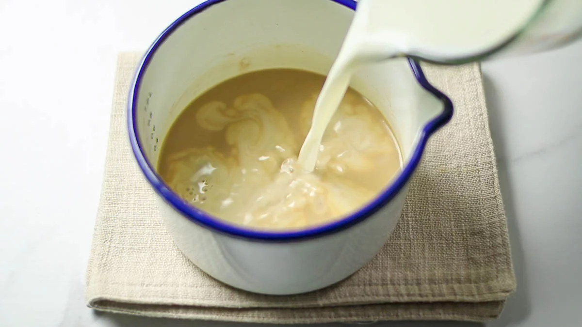 Stir in condensed milk and milk to dissolve