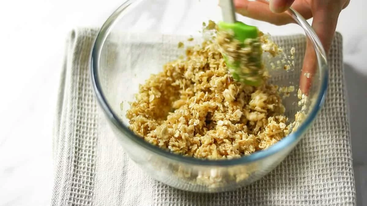 In a bowl, combine oatmeal, walnuts, brown sugar, and melted butter Mix briefly until the butter is incorporated throughout