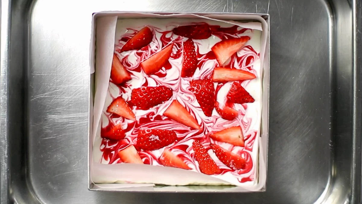 Place the sliced strawberries on top and freeze for about 2 hours until firm.