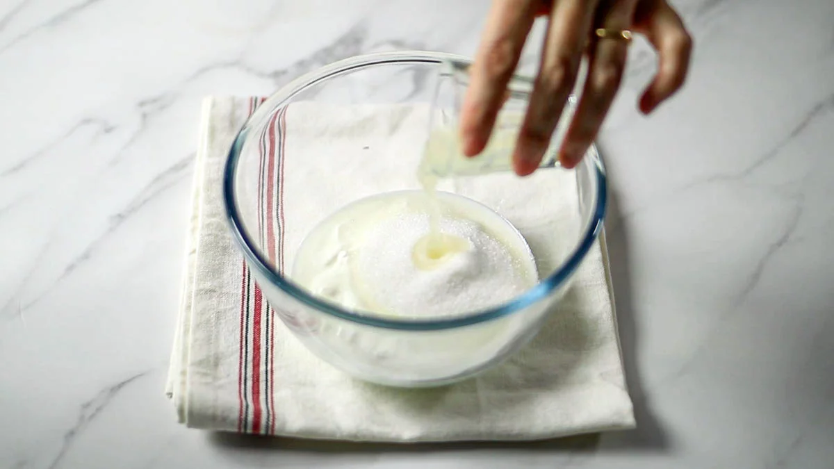 In a bowl, combine the yogurt, sugar, and lemon juice. Mix well. 

Pour the mixture into the prepared container and spread it thinly and evenly.
