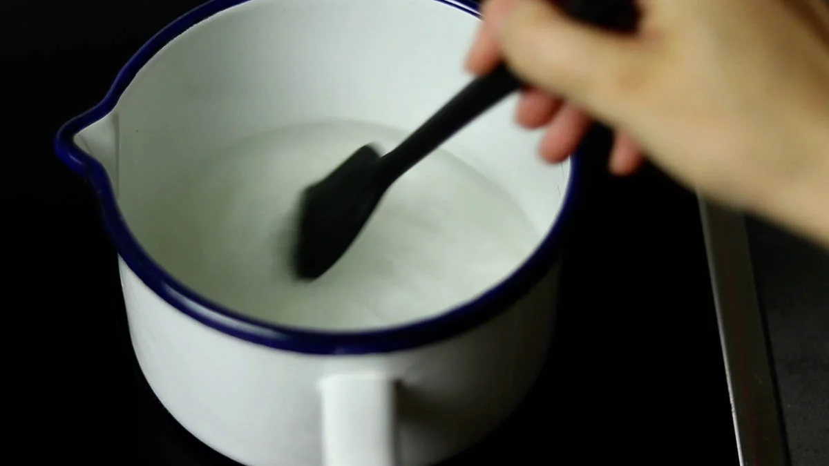 Place water and sugar in a small saucepan and heat to dissolve the sugar