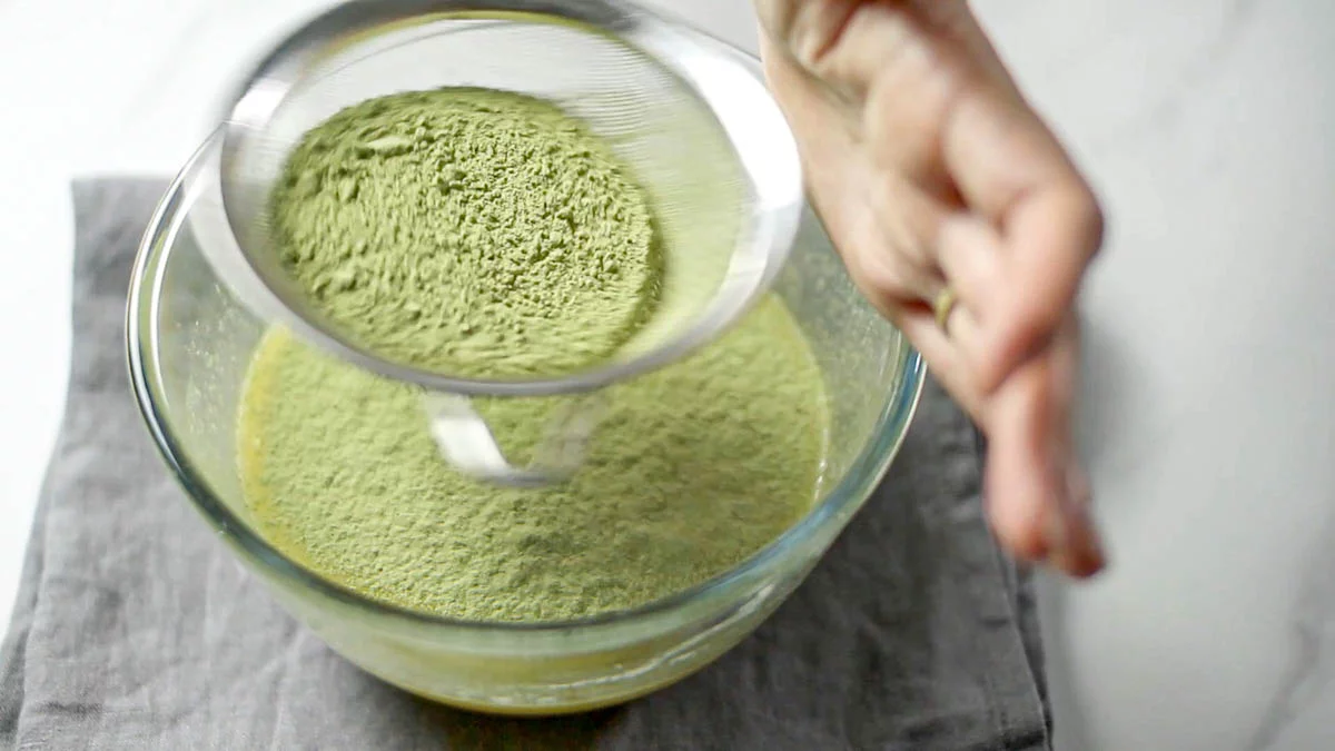 Sift in the flour and matcha powder after mixing well