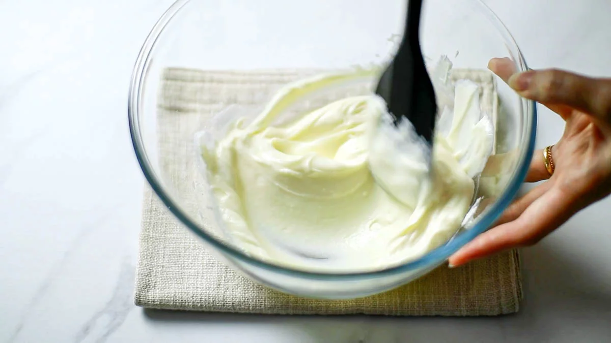 In a bowl, combine the room temperature soft cream cheese and granulated sugar and knead together with a rubber spatula