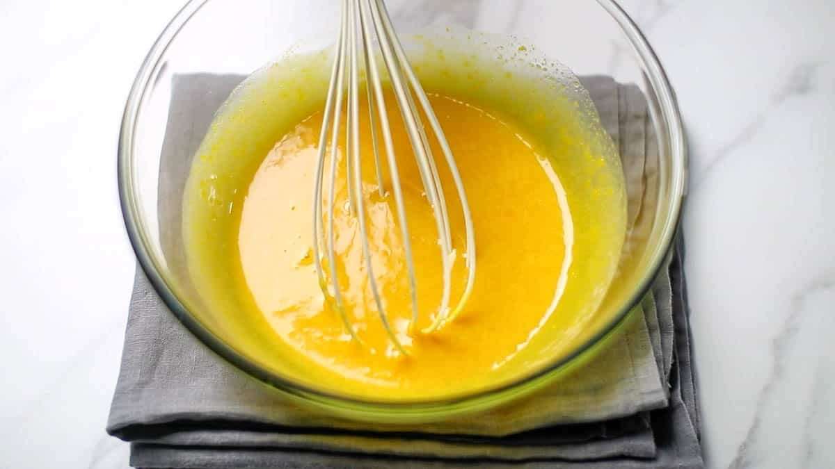 In a bowl, combine brown sugar, vegetable oil, and eggs with a whipper