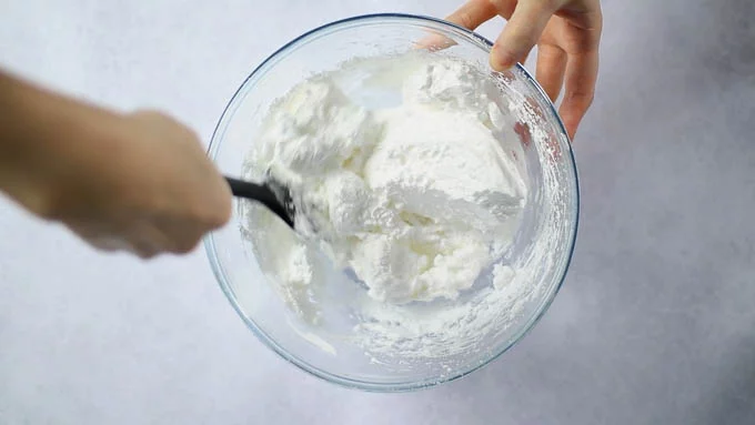 Follow the same procedure as for the chocolate-covered meringue cookies, whisking the egg whites and sugar before adding the powdered sugar and mixing until combined